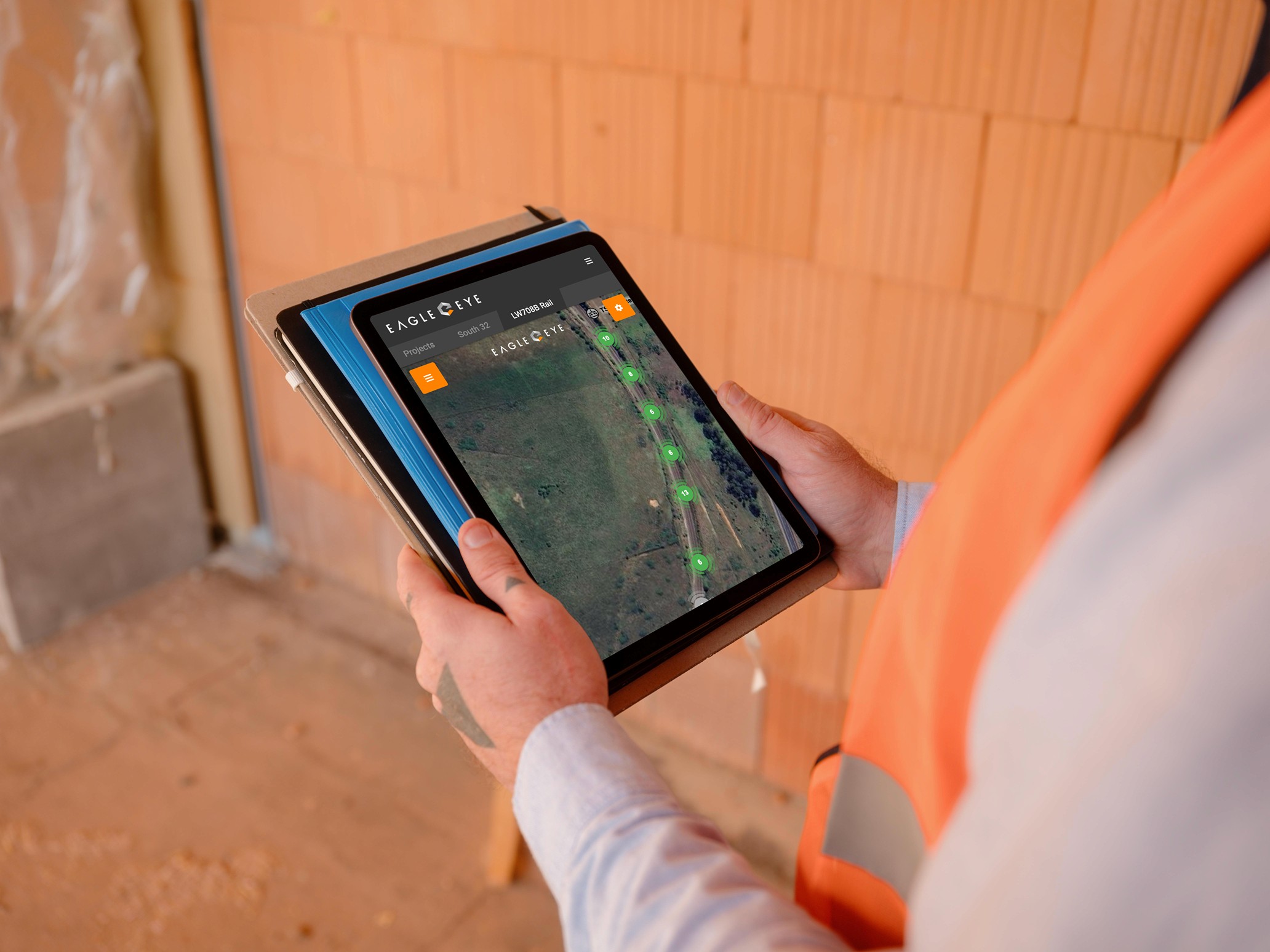 Technician reviewing Eagle-Eye monitoring data on site
